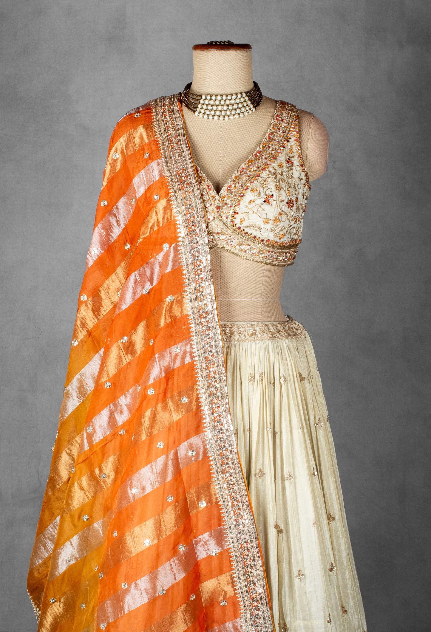 Cream Embroidered Lehenga Set with Heavy Designer Crop Top & Contrast Orange Dupatta