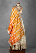 Cream Embroidered Lehenga Set with Heavy Designer Crop Top & Contrast Orange Dupatta