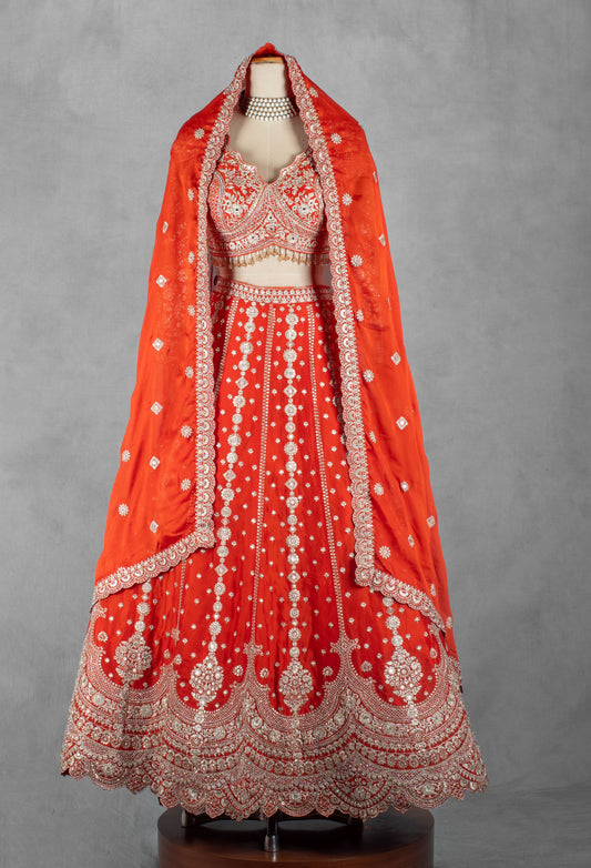 Bright orange heavy embroidered bridal lehenga with crop top and dupatta – product image 2