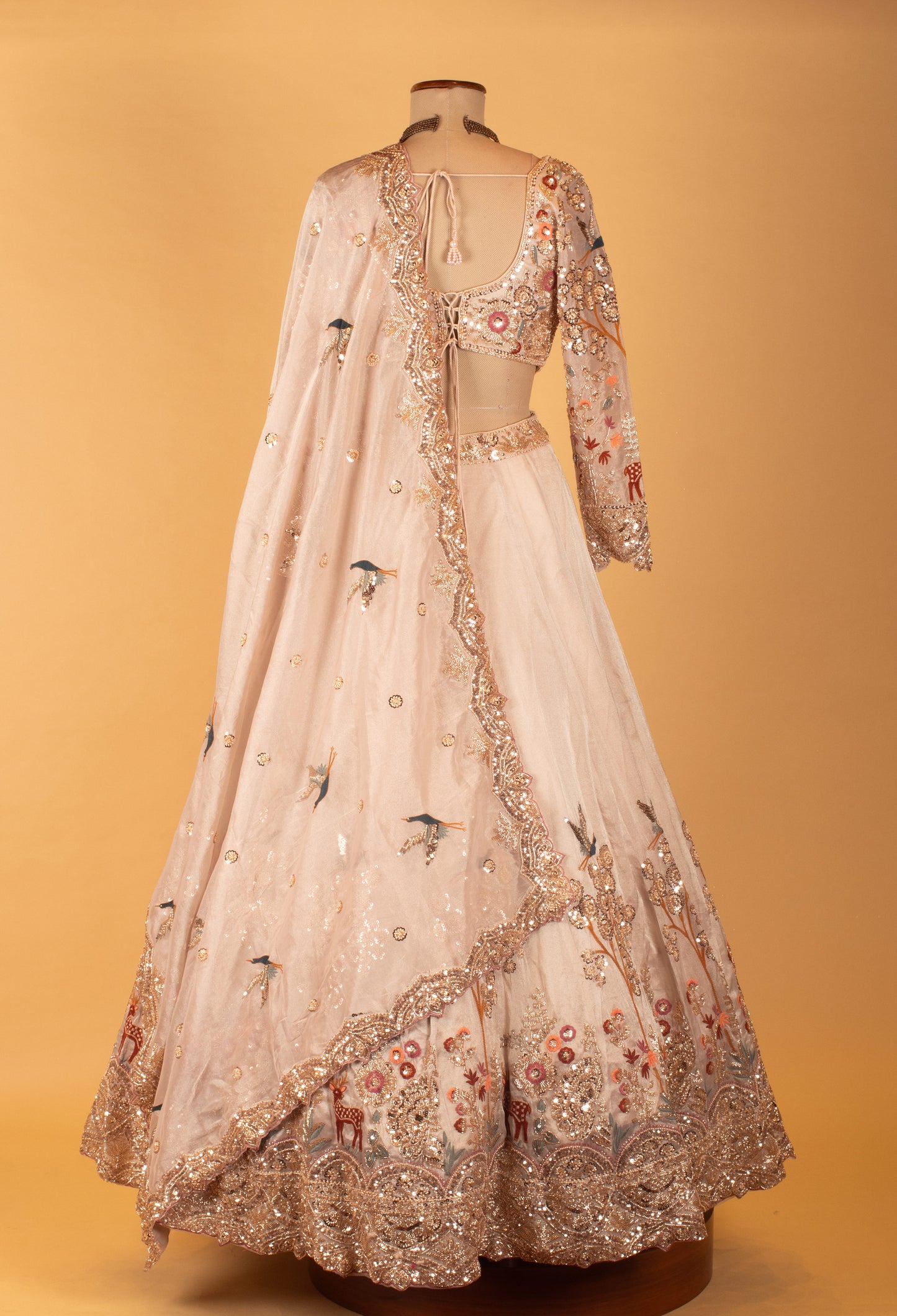 Pastel Peach Embroidered Lehenga with 3D Floral Work & Bird Motifs – Designer Bridal & Festive Wear