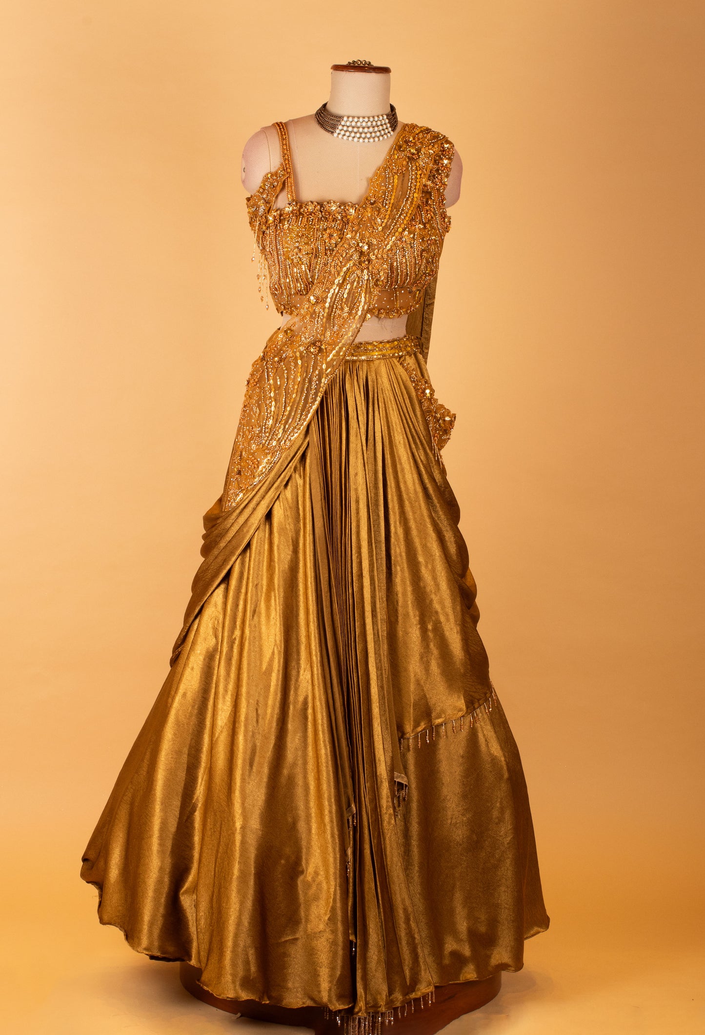 Metallic Gold Draped Lehenga with Embellished Crop Top – Designer Cocktail & Reception Wear