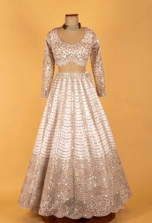 White gold bridal lehenga with sequin cut-dana and zari detailing